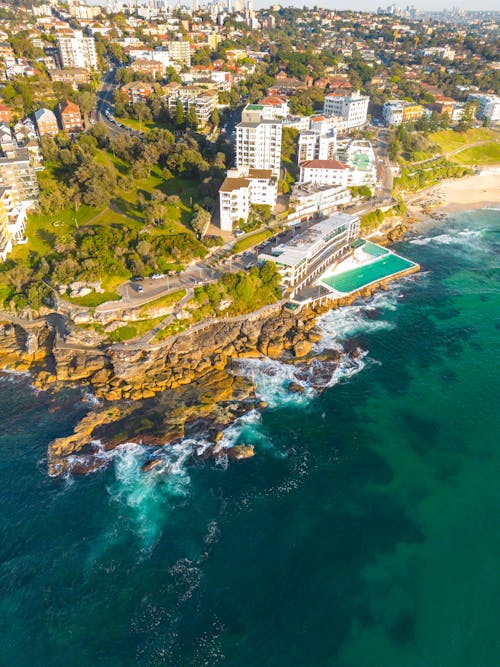 Aerial View of Hotel with Pool by Seaside