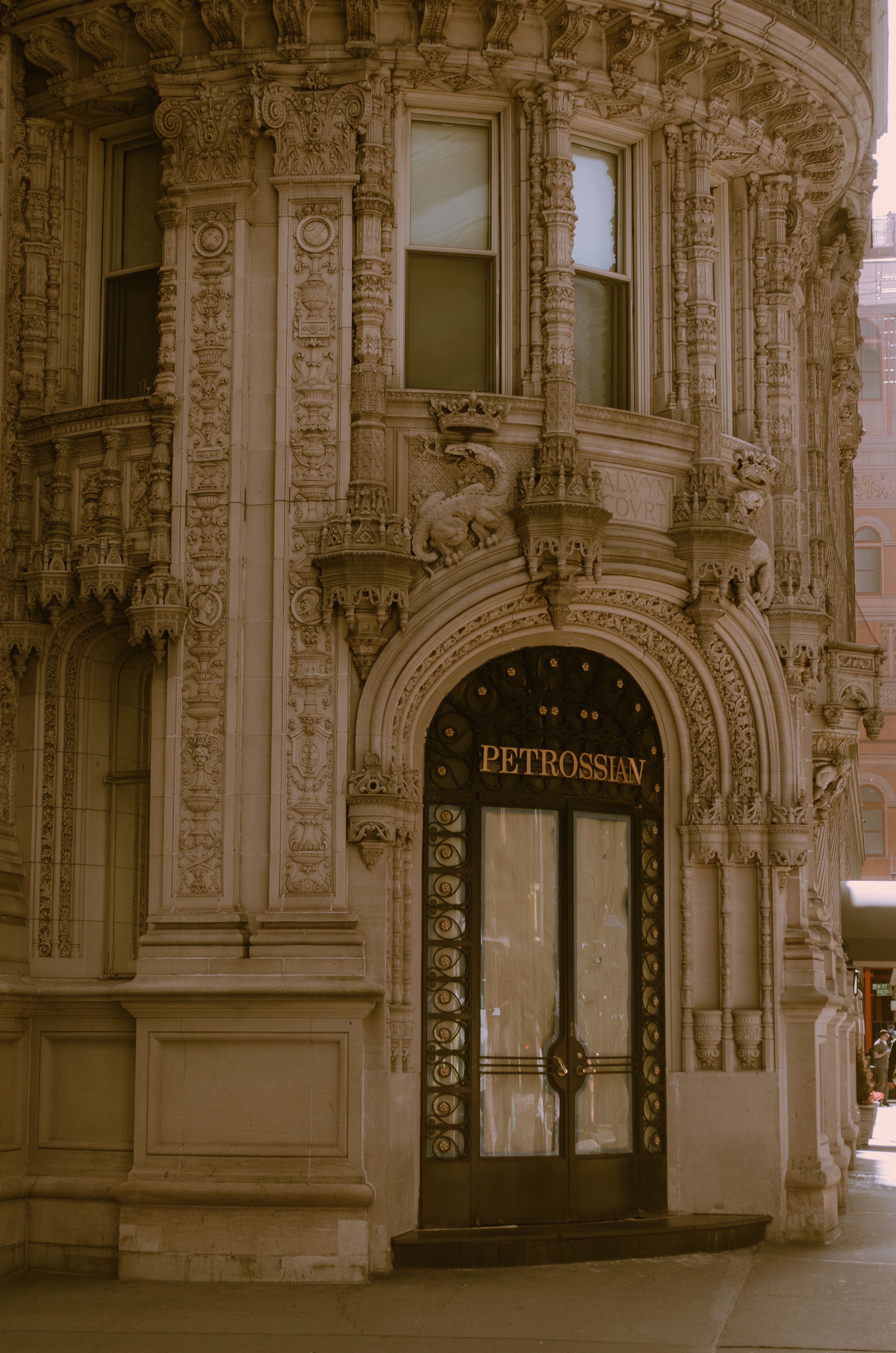 Elegant ornate entrance of Alwyn Court building in New York City.