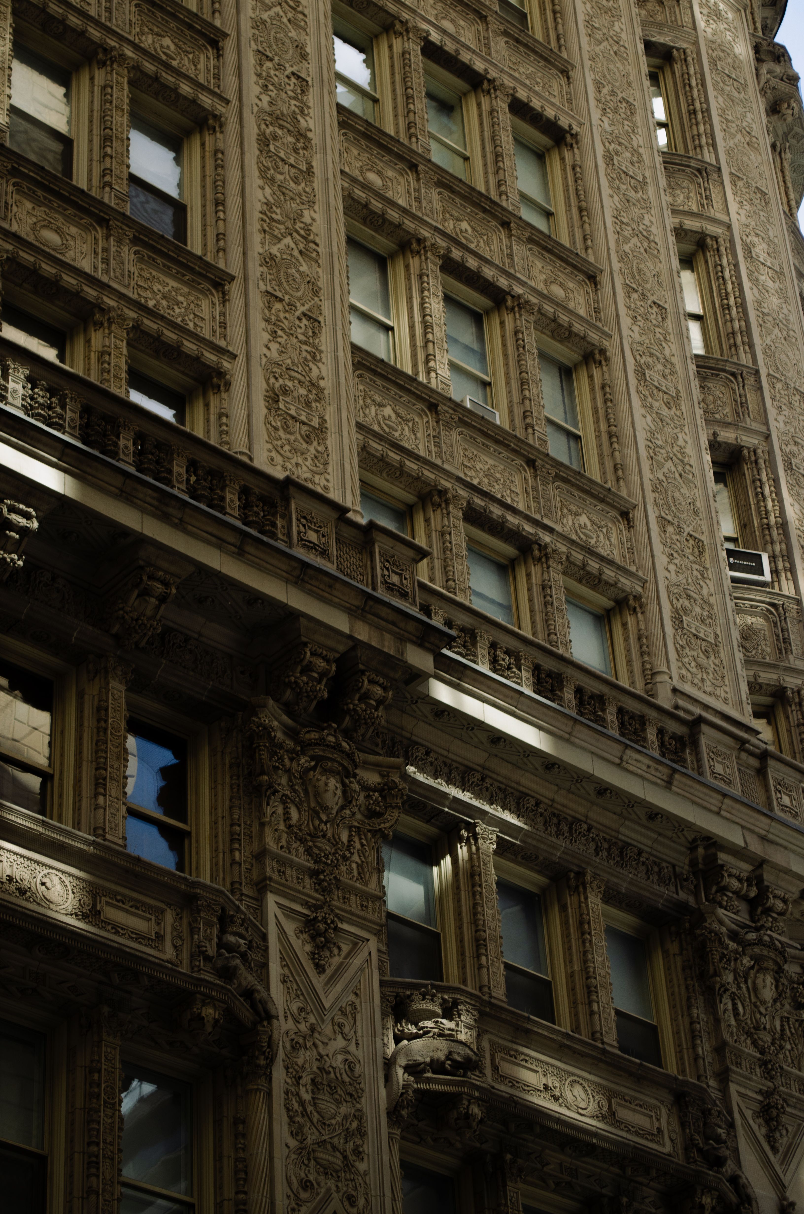 Intricate architectural details of the historic Alwyn Court facade in New York City.