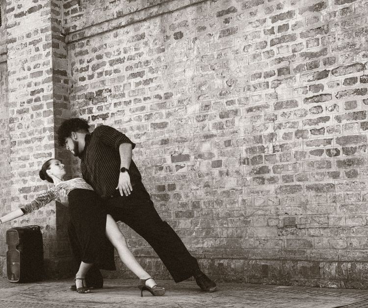 Couple in an abrazo during a milonga