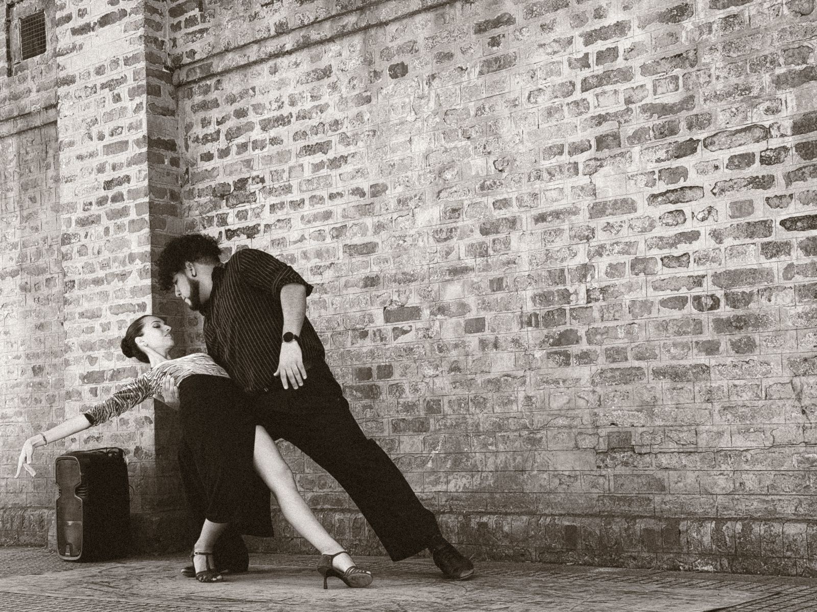 Dancer captured mid-motion showing the energetic footwork of Latin rhythms