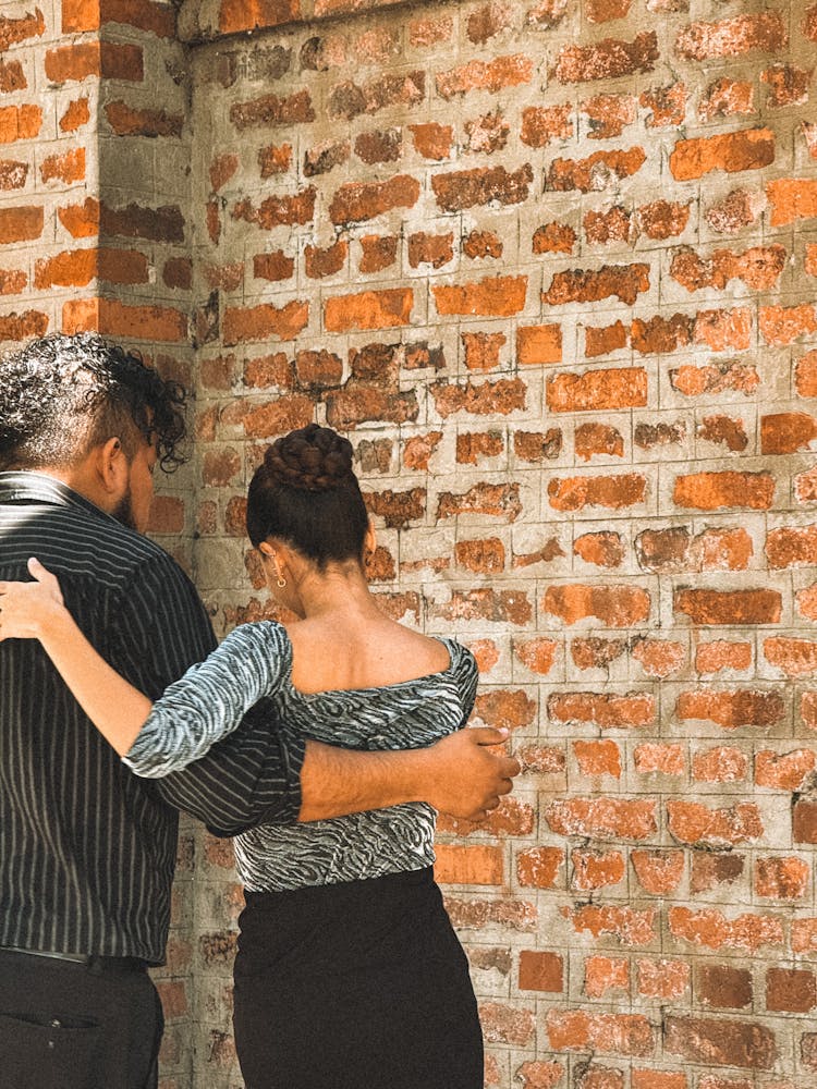 Two People Standing Outdoors 