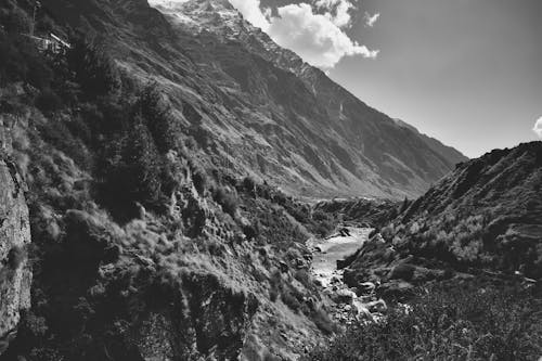 Black and white photo of a river in the mountains