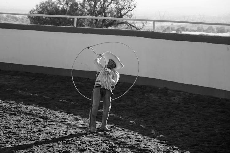 Cowboy In Hat And With Lasso In Black And White