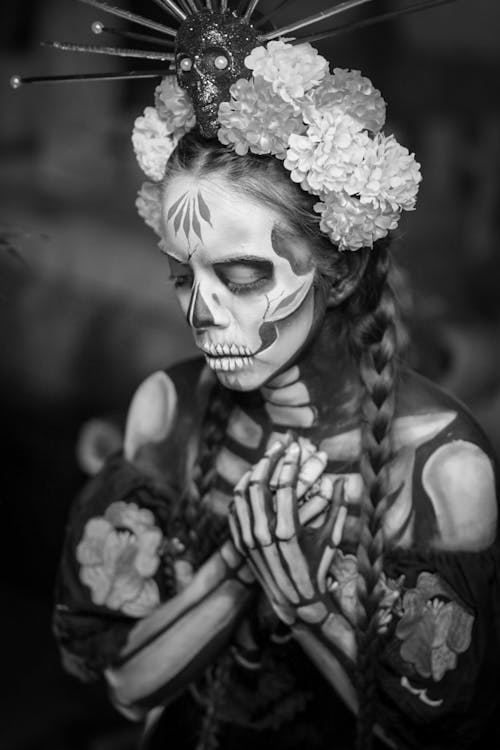 Free A black and white photo of a woman in a skeleton costume Stock Photo