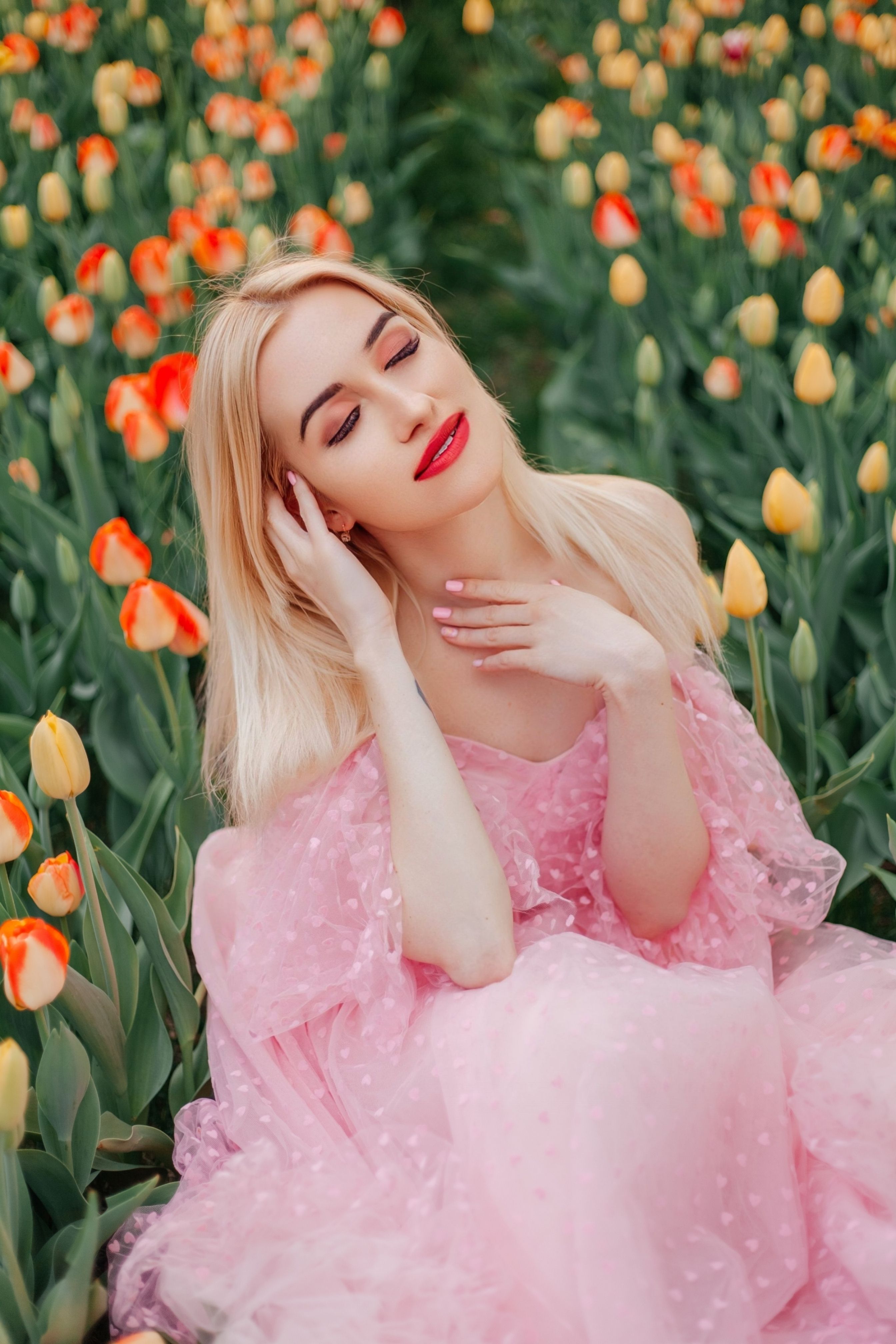 A Woman Sitting in a Pink Dress · Free Stock Photo