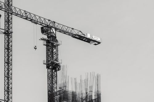 Free Black and white image of a tower crane at a construction site in Mexico City. Stock Photo