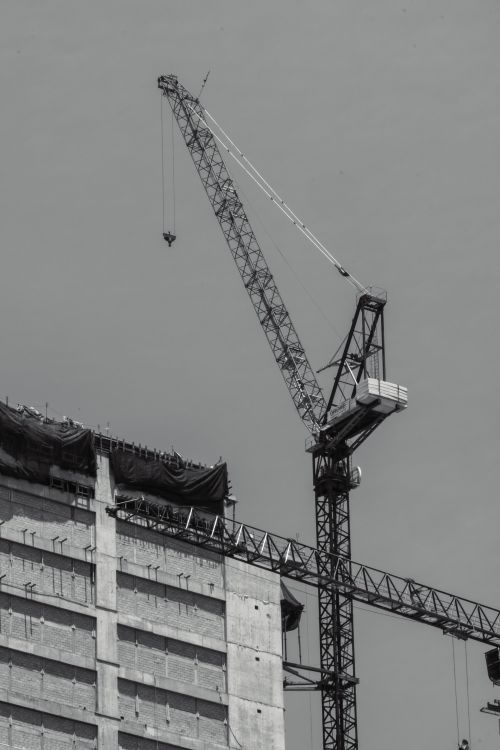 Construction Crane and Site in Black and White · Free Stock Photo