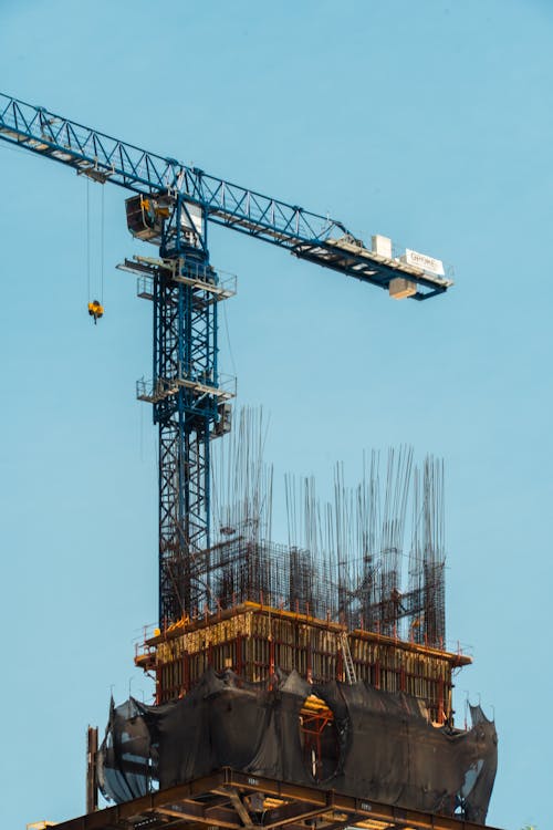 A crane is working on a building under construction