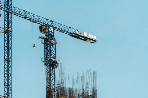 Free Construction cranes and a blue sky Stock Photo