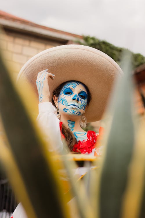 A woman in a mexican costume with a sombrero