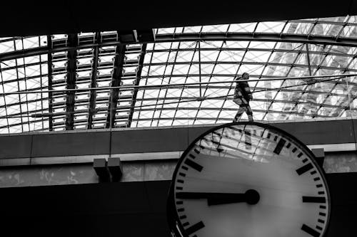 A person walking on the top of a clock