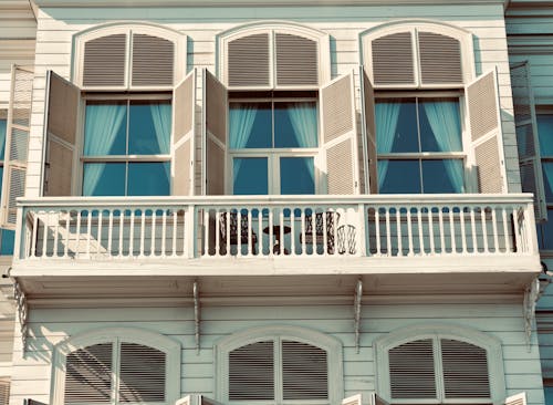 Free A balcony with a white and blue window Stock Photo