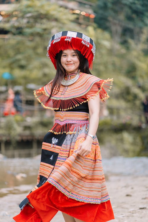Portrait of a Pretty Brunette Wearing a Traditional Dress and a Hat