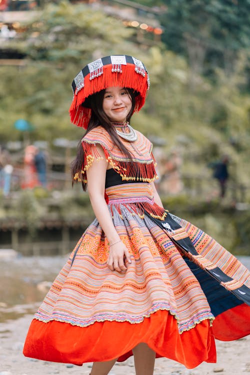 Portrait of a Pretty Girl Wearing a Traditional Dress and a Hat