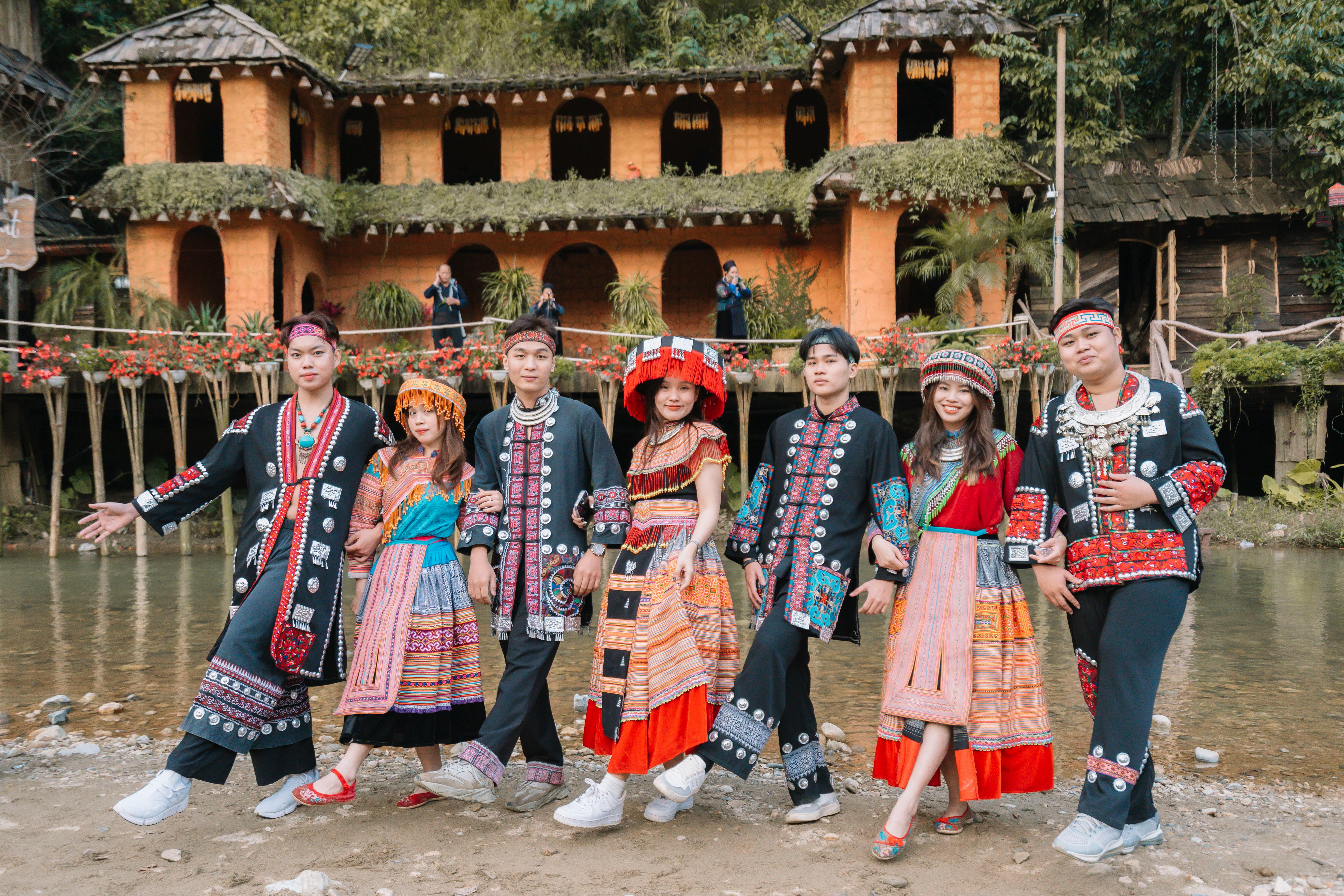 A group of people in traditional clothing posing for a photo