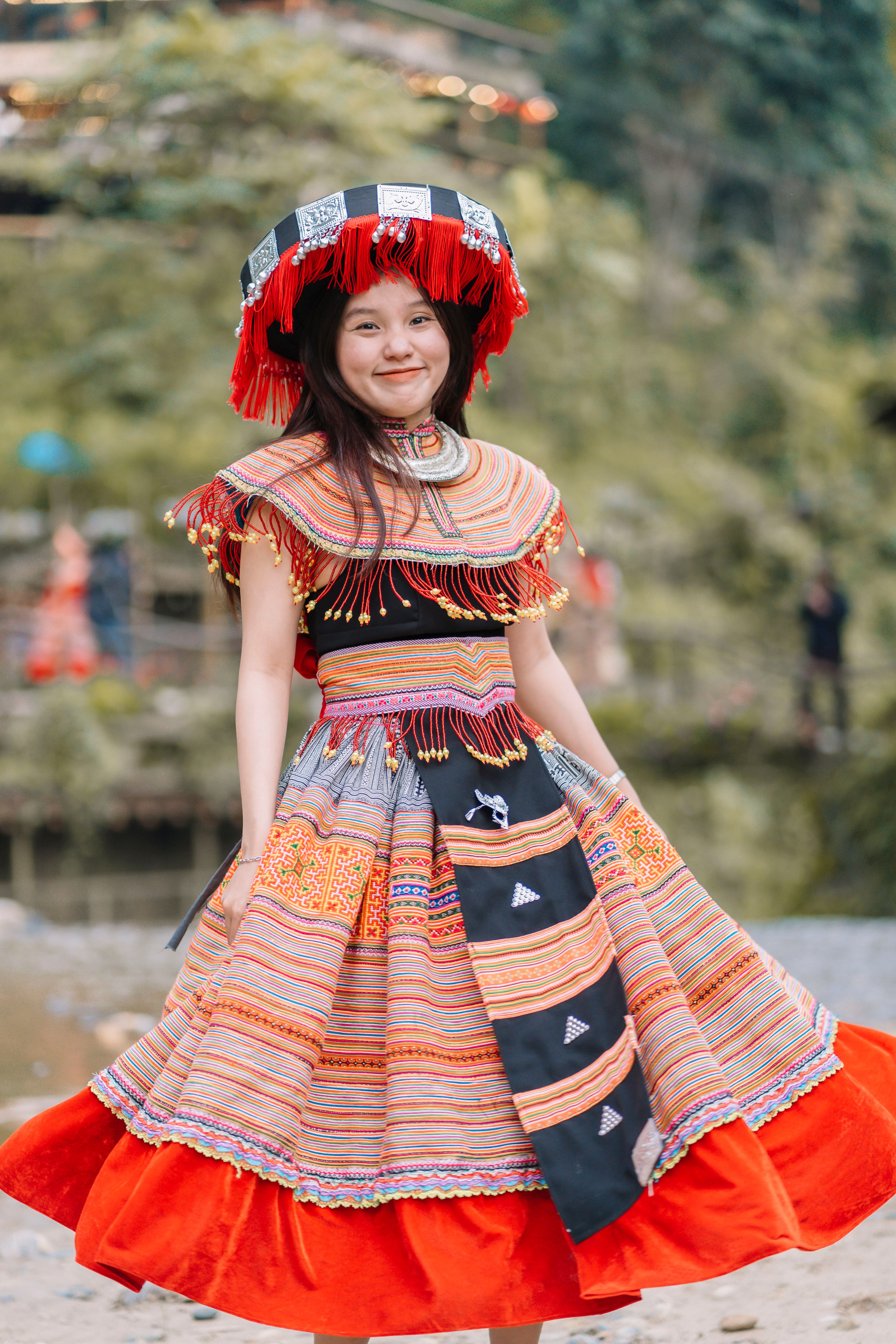 A young girl in traditional costume posing for the camera · Free Stock ...