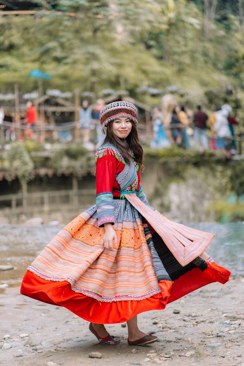 Portrait of a Pretty Brunette Wearing a Traditional Dress and a Hat