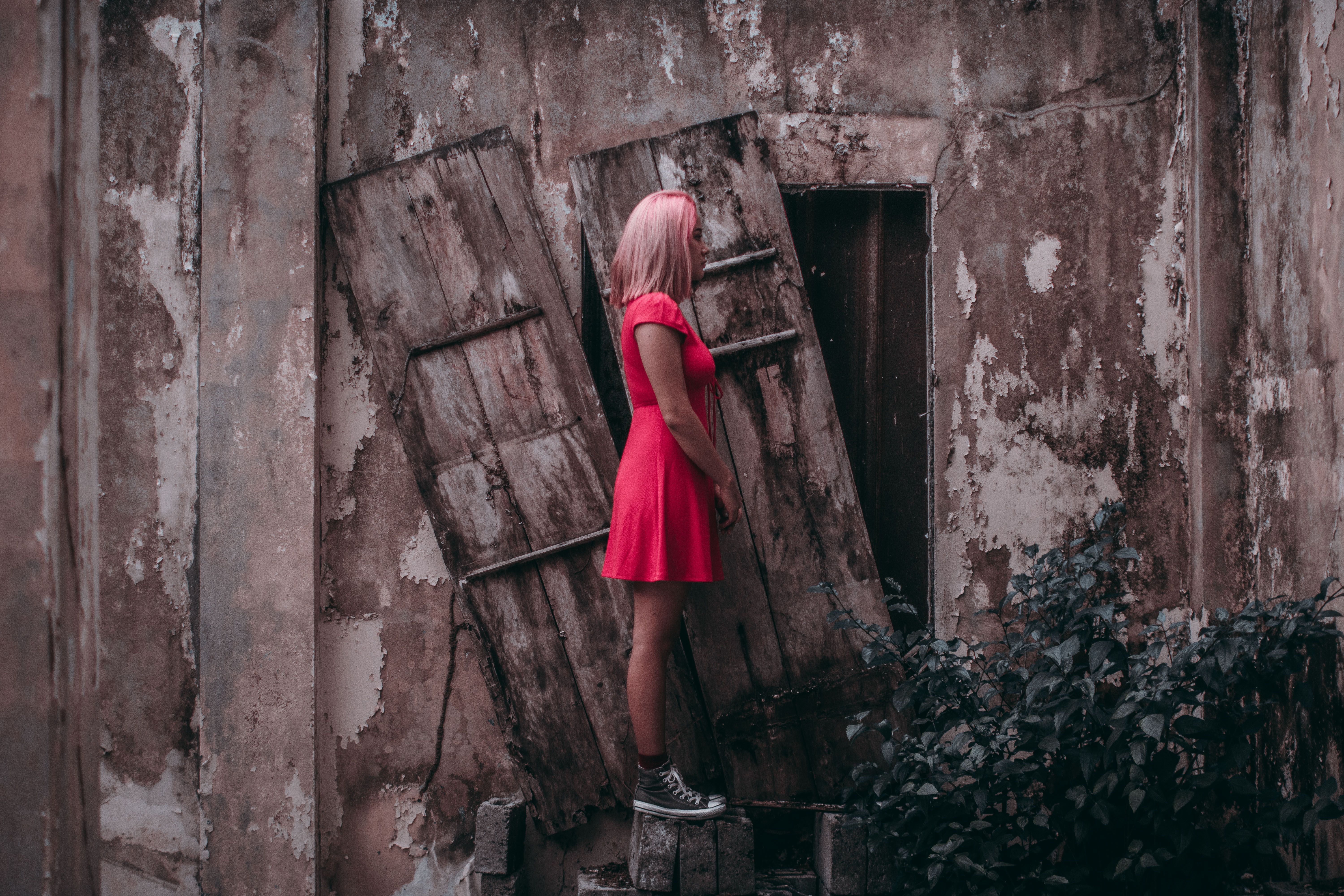 Woman Leaning On A Rusty Metal · Free Stock Photo