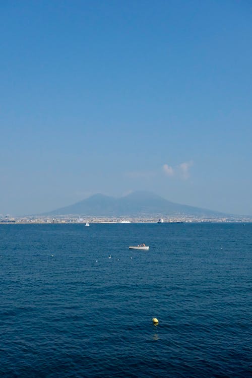 A view of the sea and a mountain in the distance