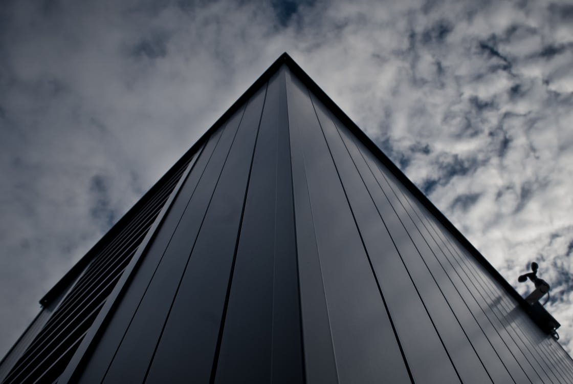 Worm's Eye View of Building Under White Cloudy Sky