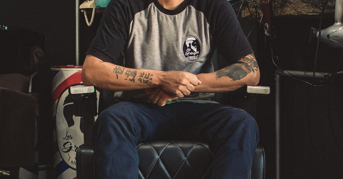 Man Sitting On Barber Chair Inside Room