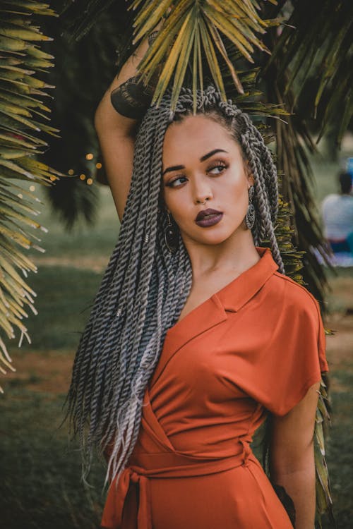 Photo of Woman Wearing Orange Dress