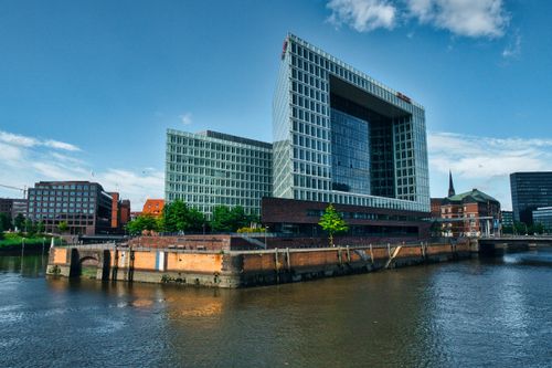 Free Modern architecture of the Spiegel Building by the River Elbe in Hamburg, Germany under a clear blue sky. Stock Photo