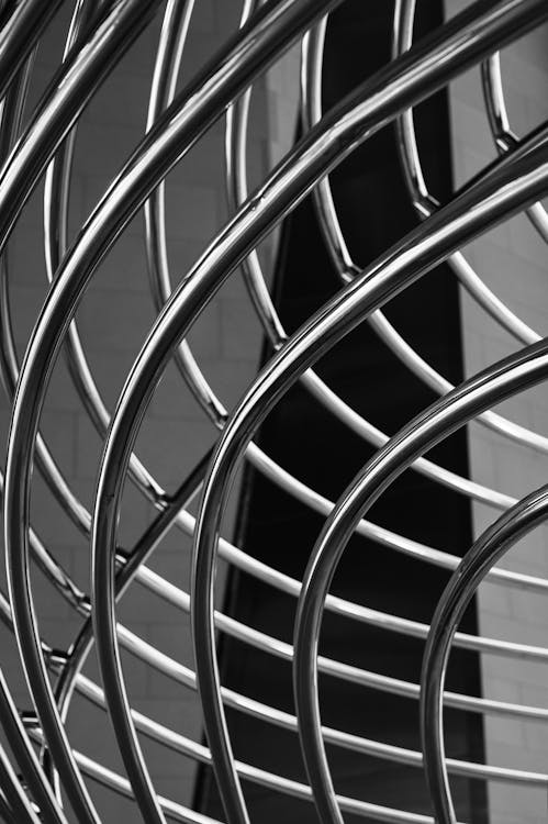 A black and white photo of a metal fan