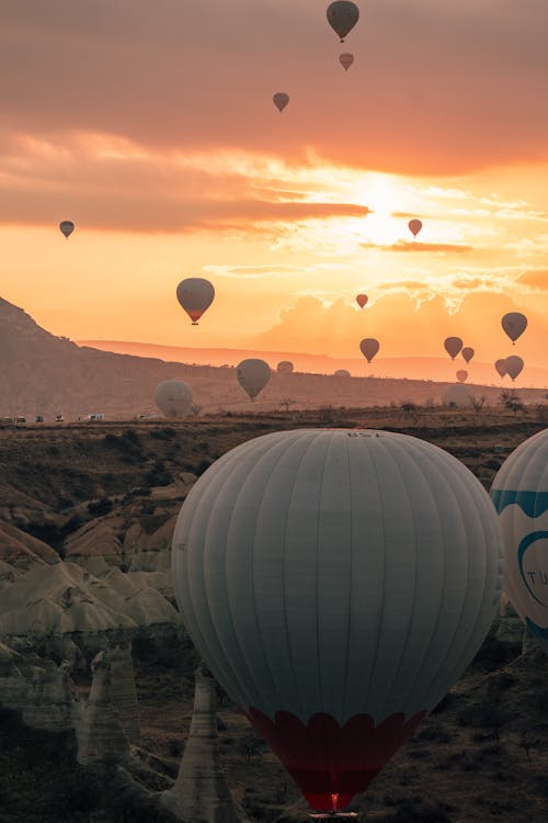 Hot Air Balloons Flying in Cappadocia at Sunset