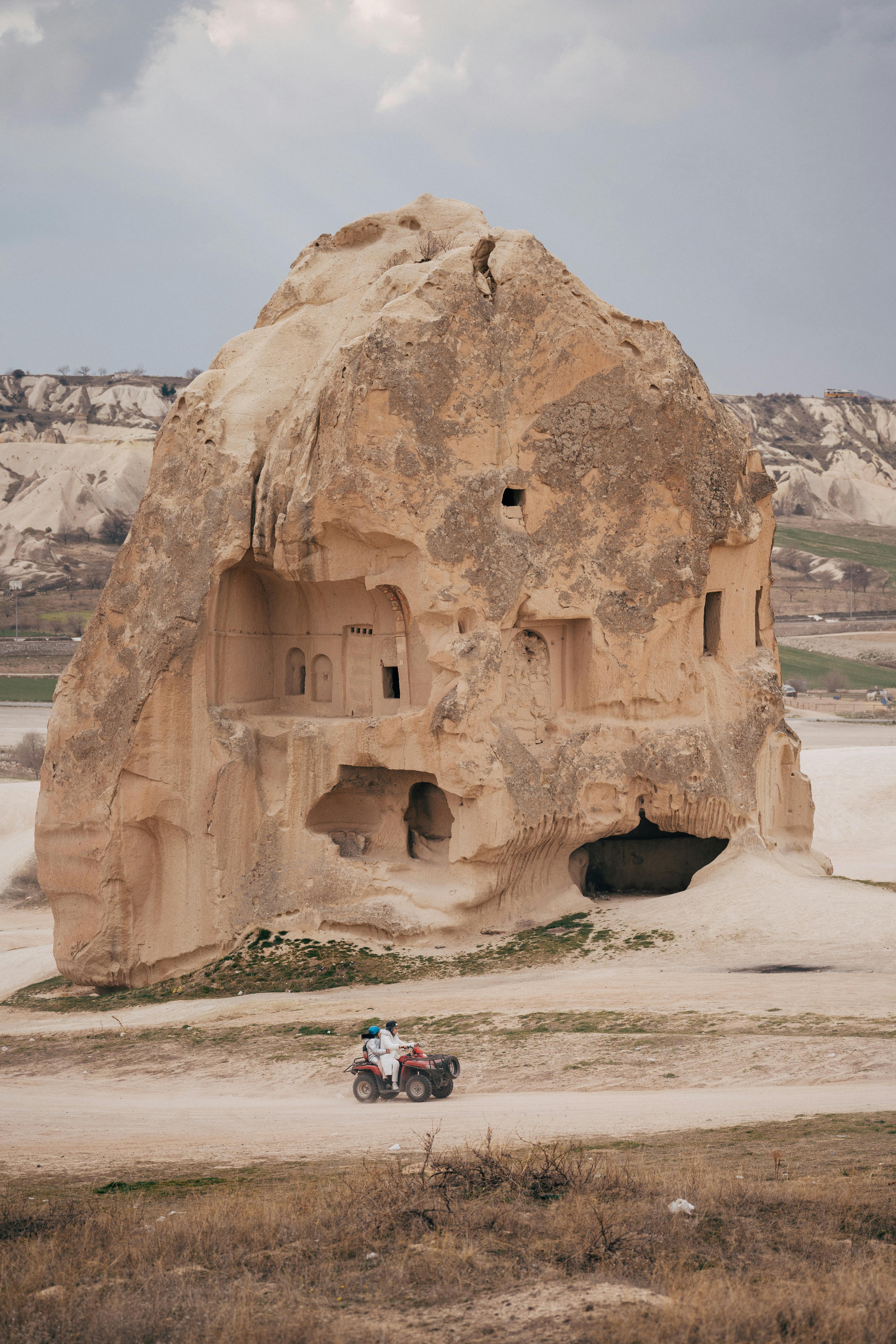 houses carved in rock formation in cappadocia