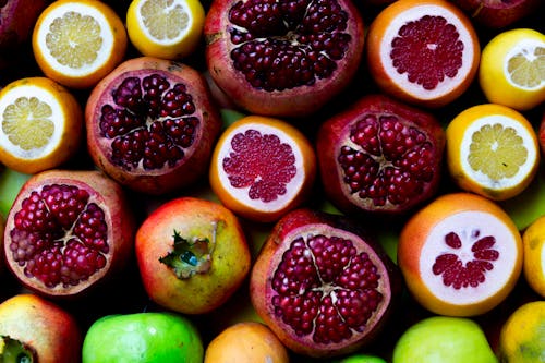 Безкоштовне стокове фото на тему «Гранат, Грейпфрут, достаток»