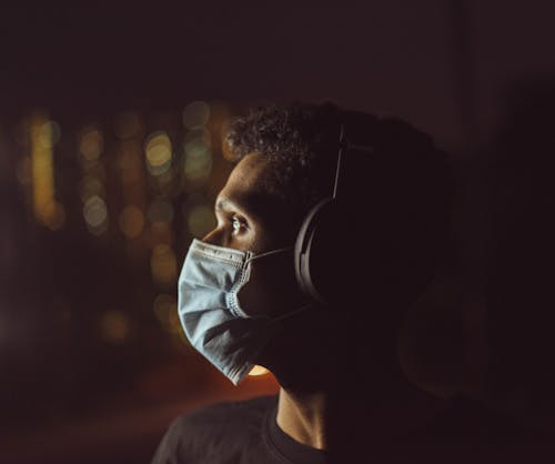 Portrait of Man in Mask and Headphones