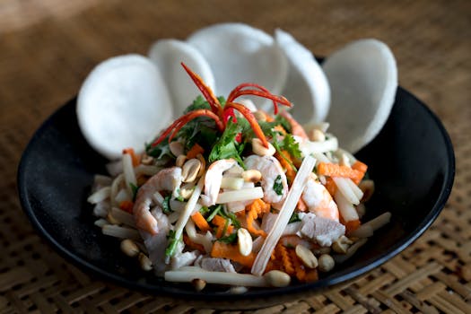 A vibrant Asian shrimp salad with fresh vegetables and peanuts, perfect for a healthy meal.