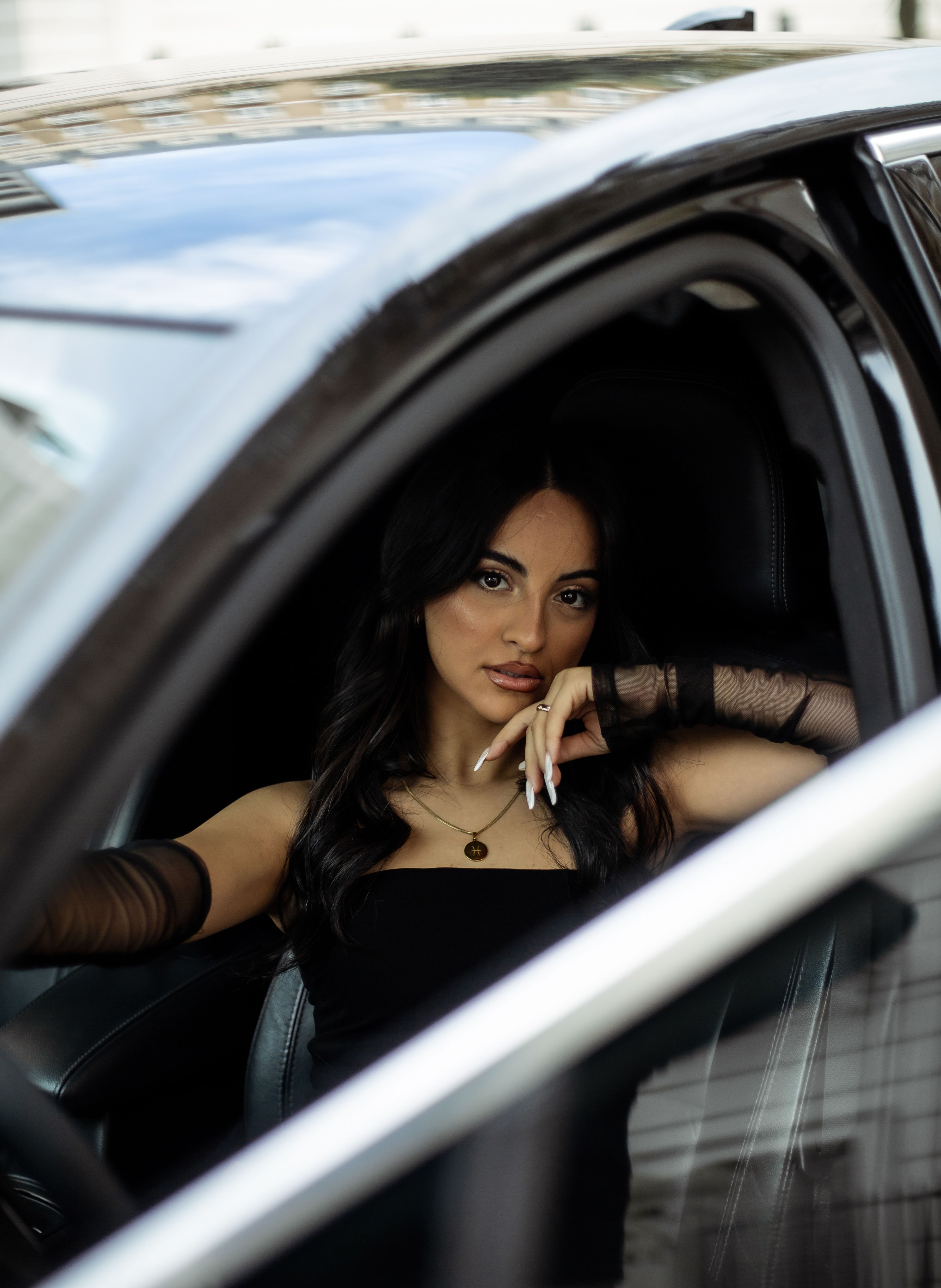 Brunette Woman Sitting in a Car · Free Stock Photo