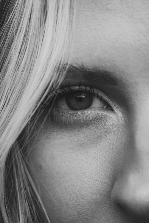 Close-Up Black and White Photo of a Woman Face