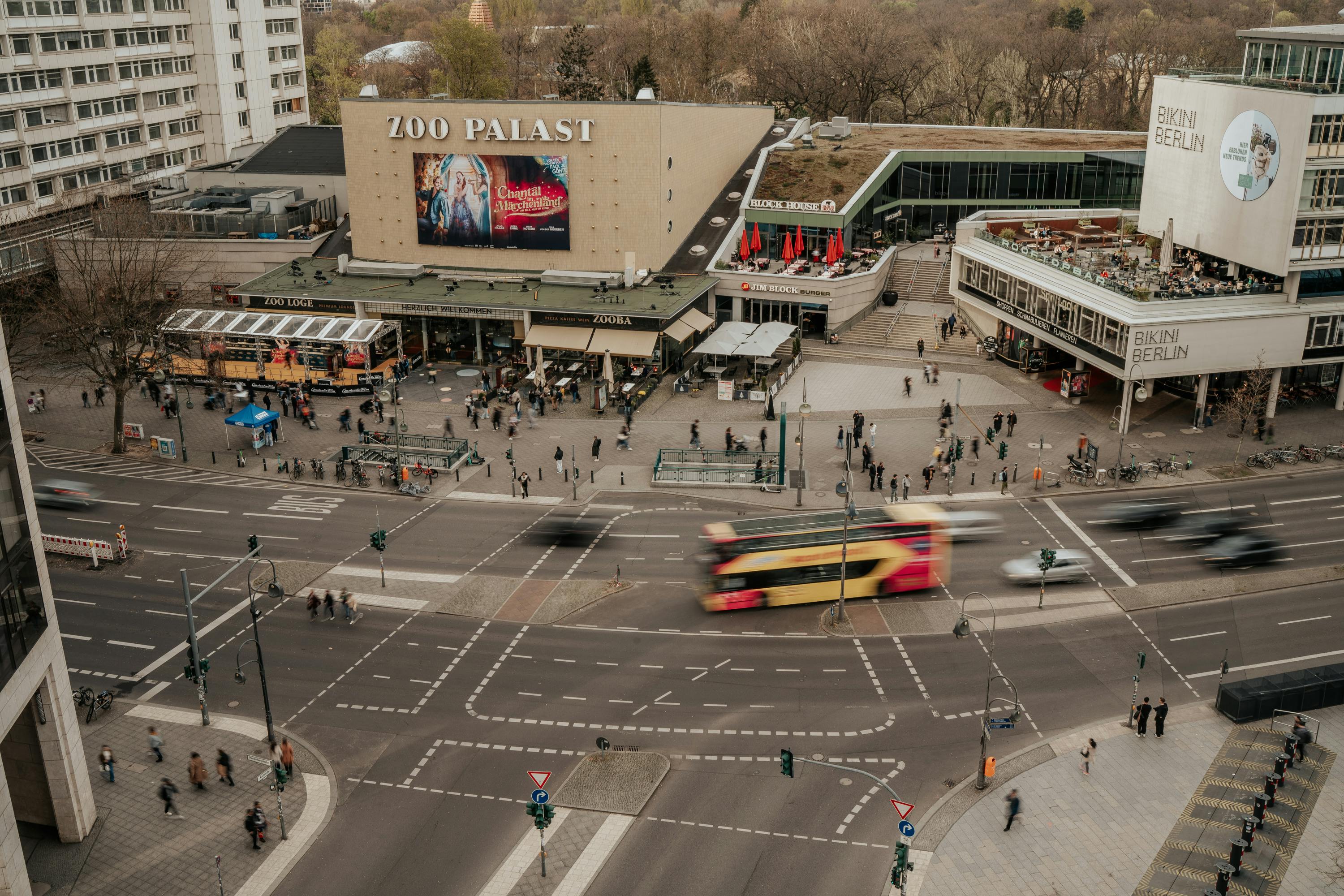 Aerial view of Zoo Palast and vibrant intersection in Berlin captured during the day.