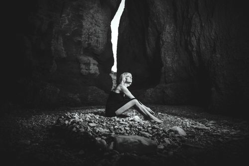 Free A woman sits barefoot in a dramatic canyon, embracing the natural beauty of Mount Charleston, Nevada. Stock Photo