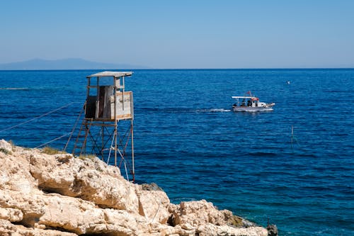 Lifeguard Tower and Passing Boat on the Crystalline Coast