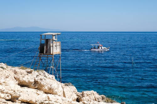 Lifeguard Tower and Passing Boat on the Crystalline Coast