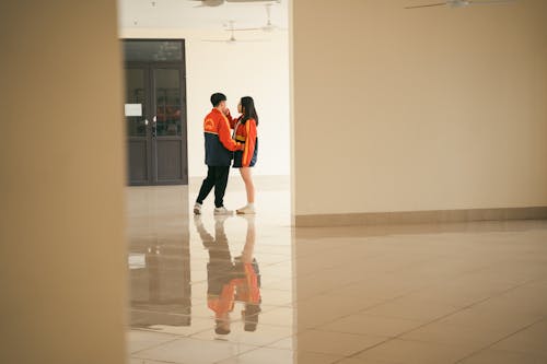 Couple in Jackets Standing Together