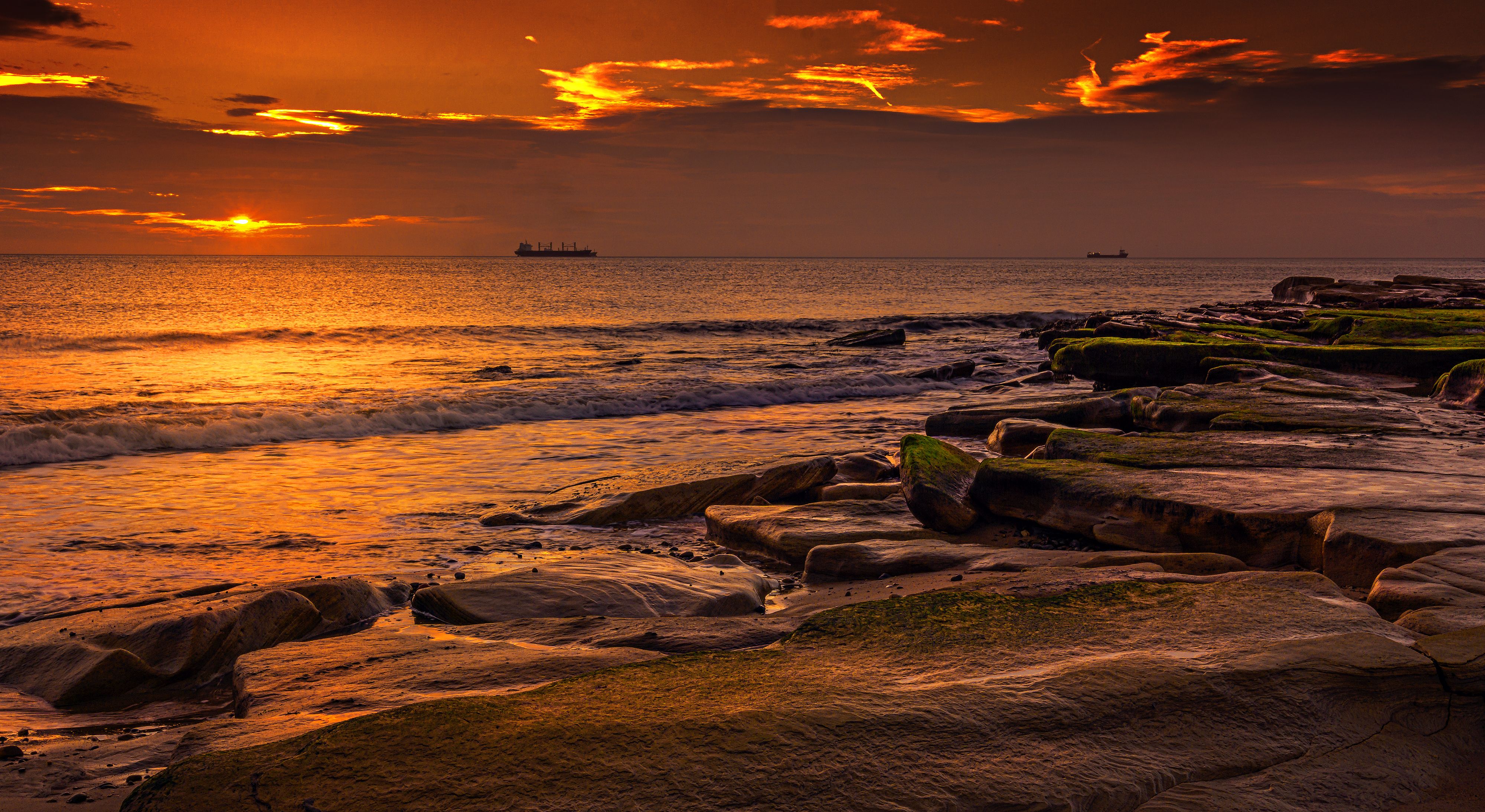 Rocks on Sea Shore at Sunset · Free Stock Photo
