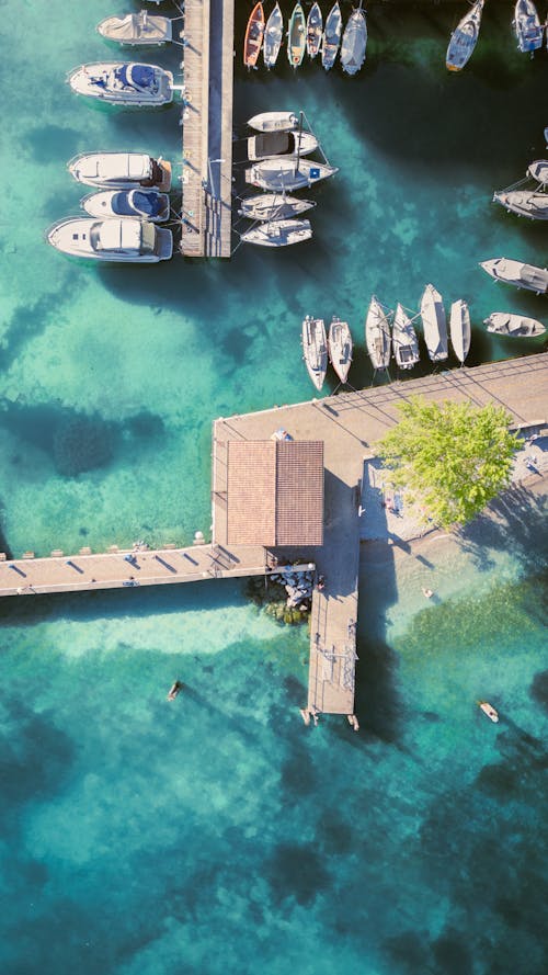 Aerial view of a dock with boats and a pier