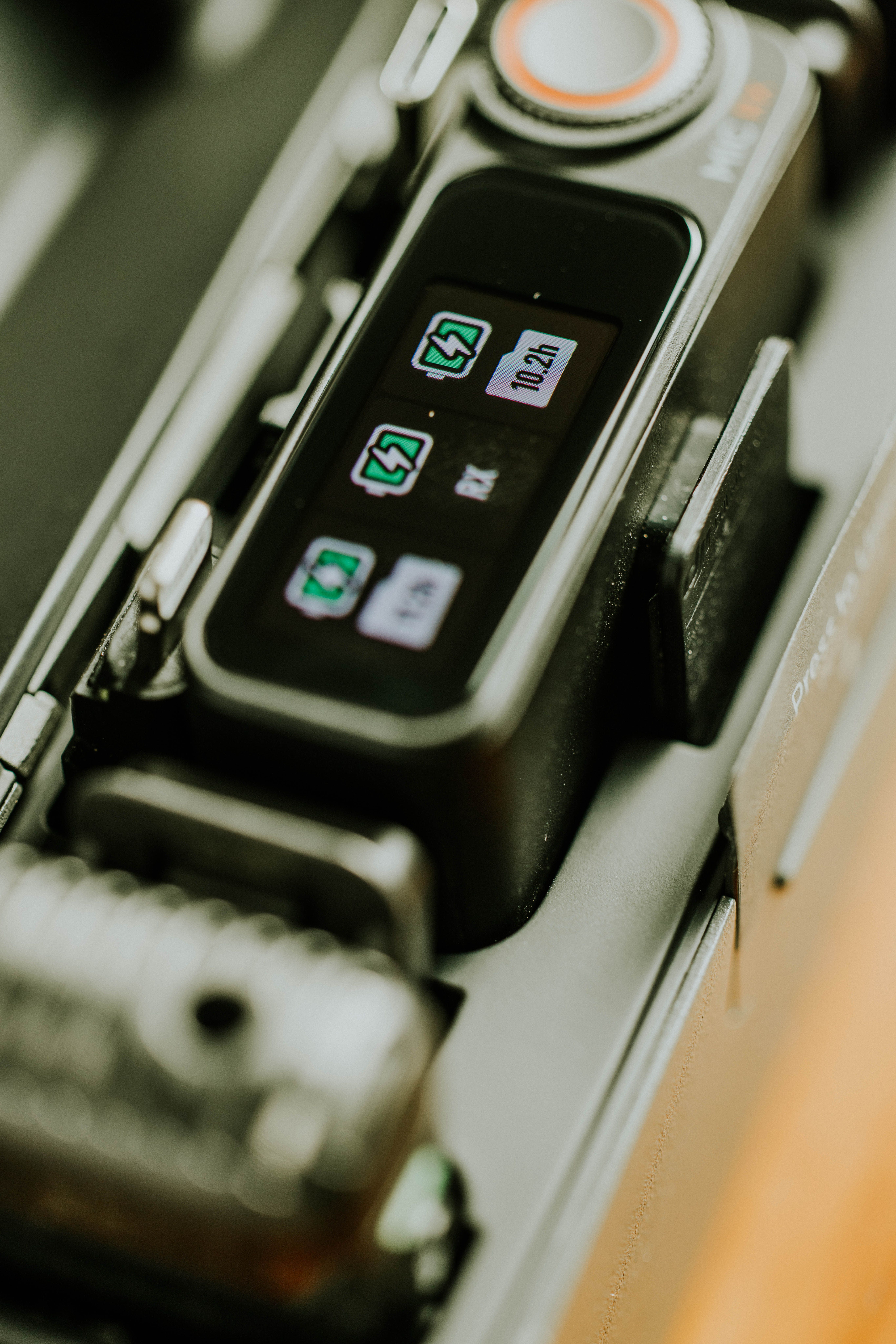 A close-up view of a device with a digital display showing charging status, emphasizing modern technology.