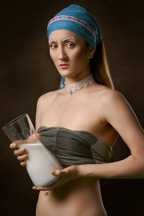 Woman Holding Clear Glass Jar
