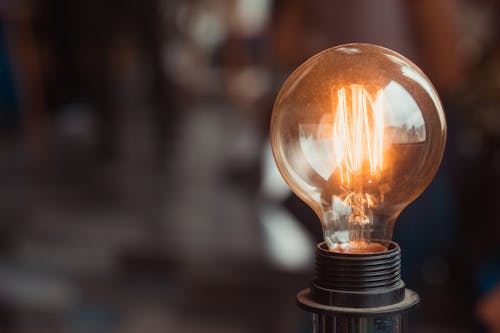 Free Selective Focus Photography of Turned-on Light Bulb Stock Photo