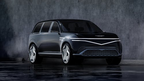 The Genesis Neolun Concept in front of a dark wall.