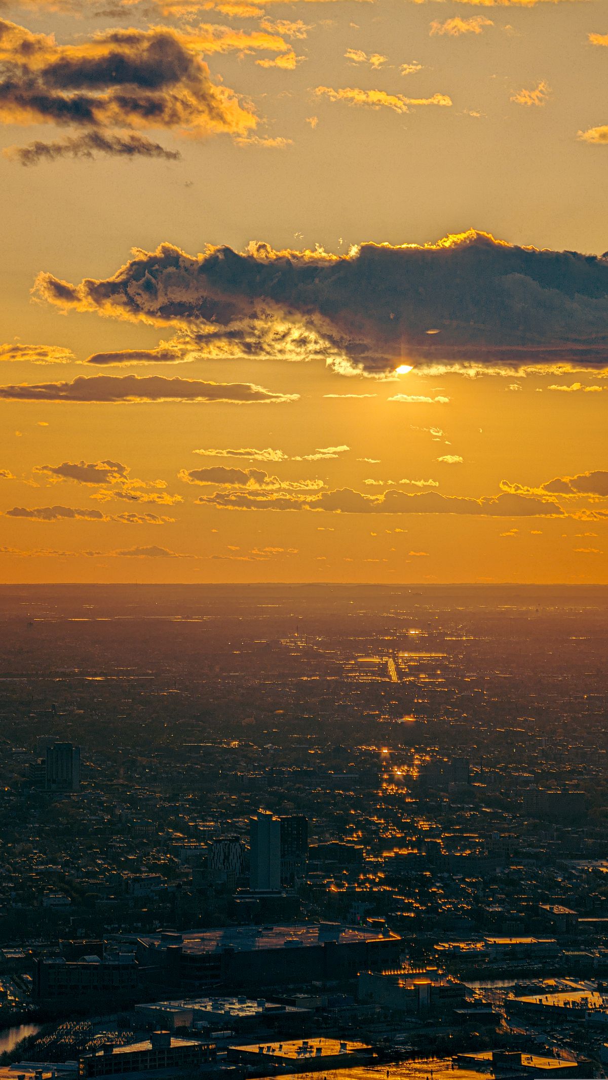 City skyline with illuminated skyscrapers at sunset golden hour