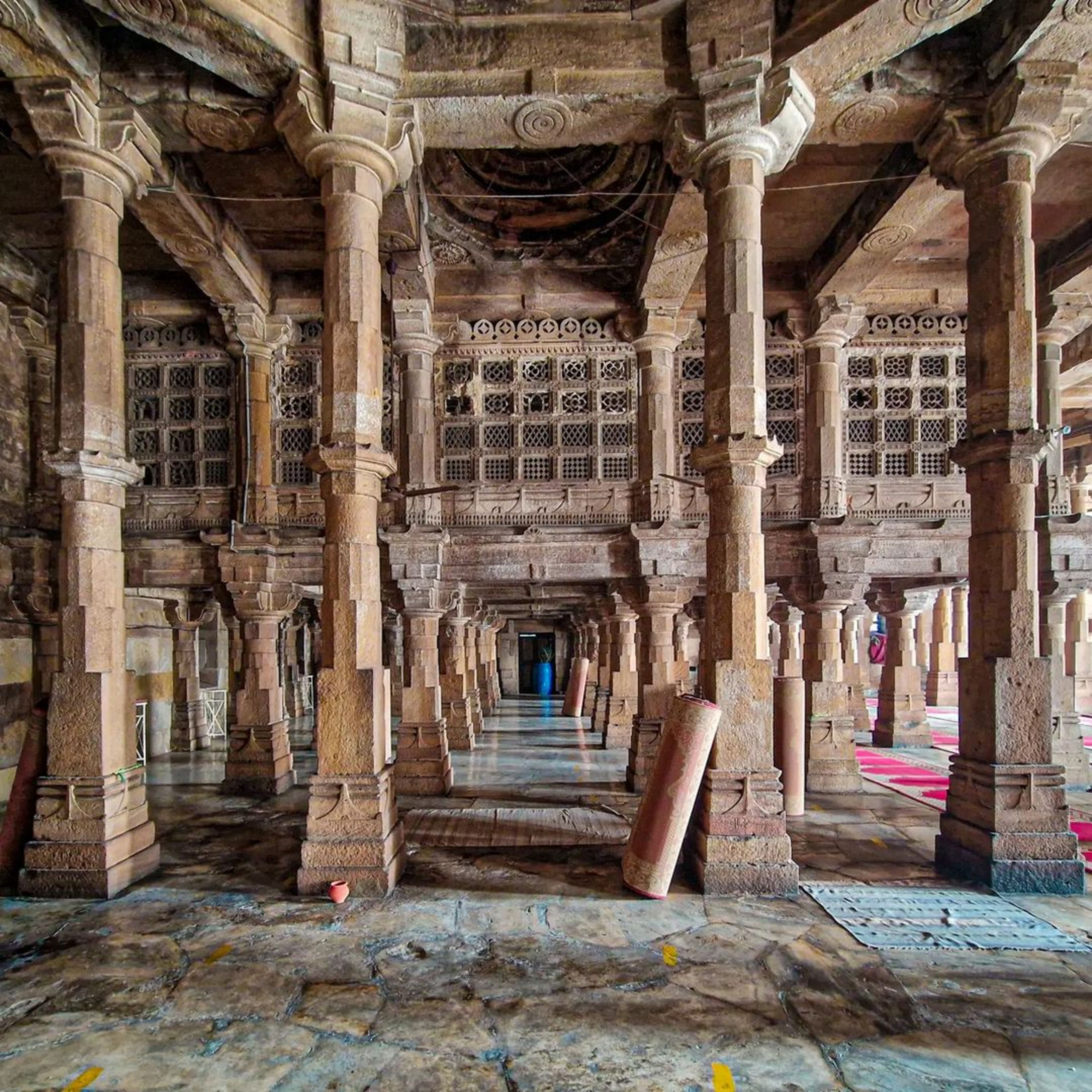 Explore the detailed stonework of the historic Jama Masjid in Ahmedabad, India.