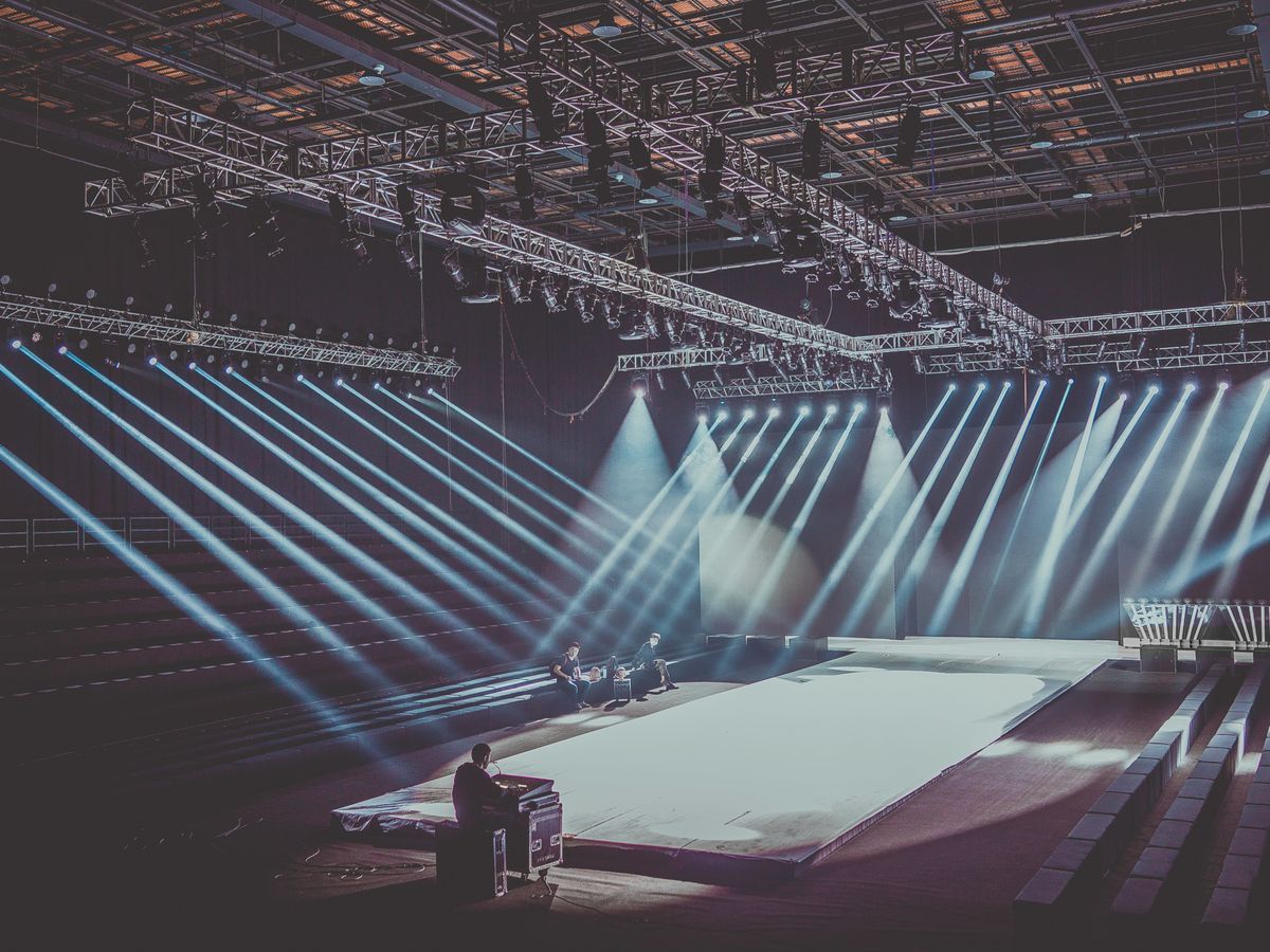 Load-in — truss up, wall going together